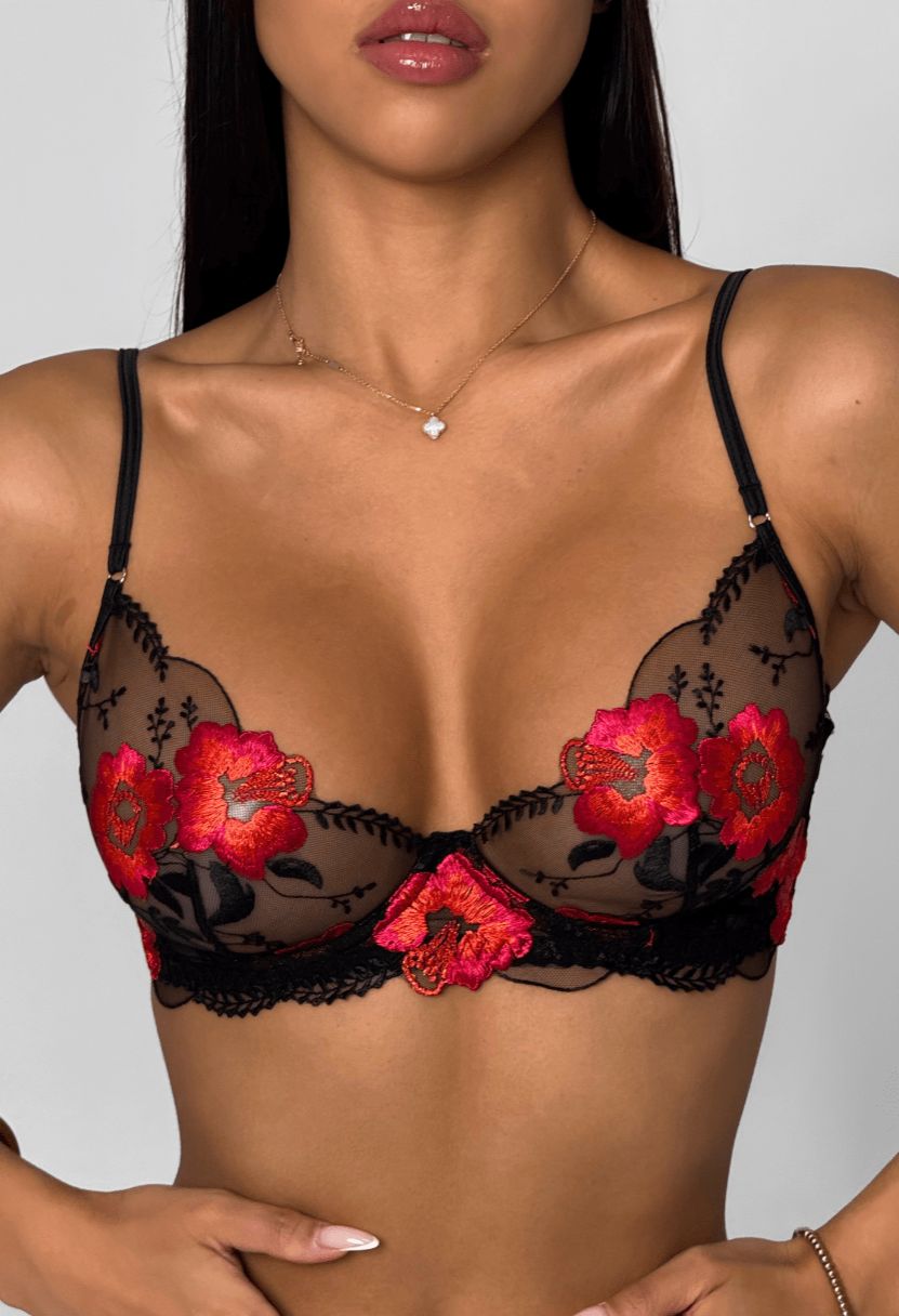 Lily black demi bra with red floral embroidery on model, close-up front view