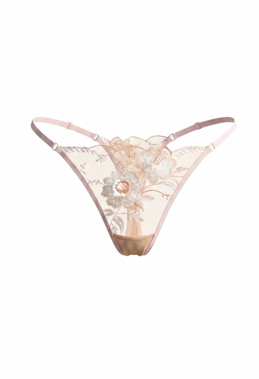 A pale pink and beige lace thong with floral embroidery and a scalloped waistband, shown against a plain white background.