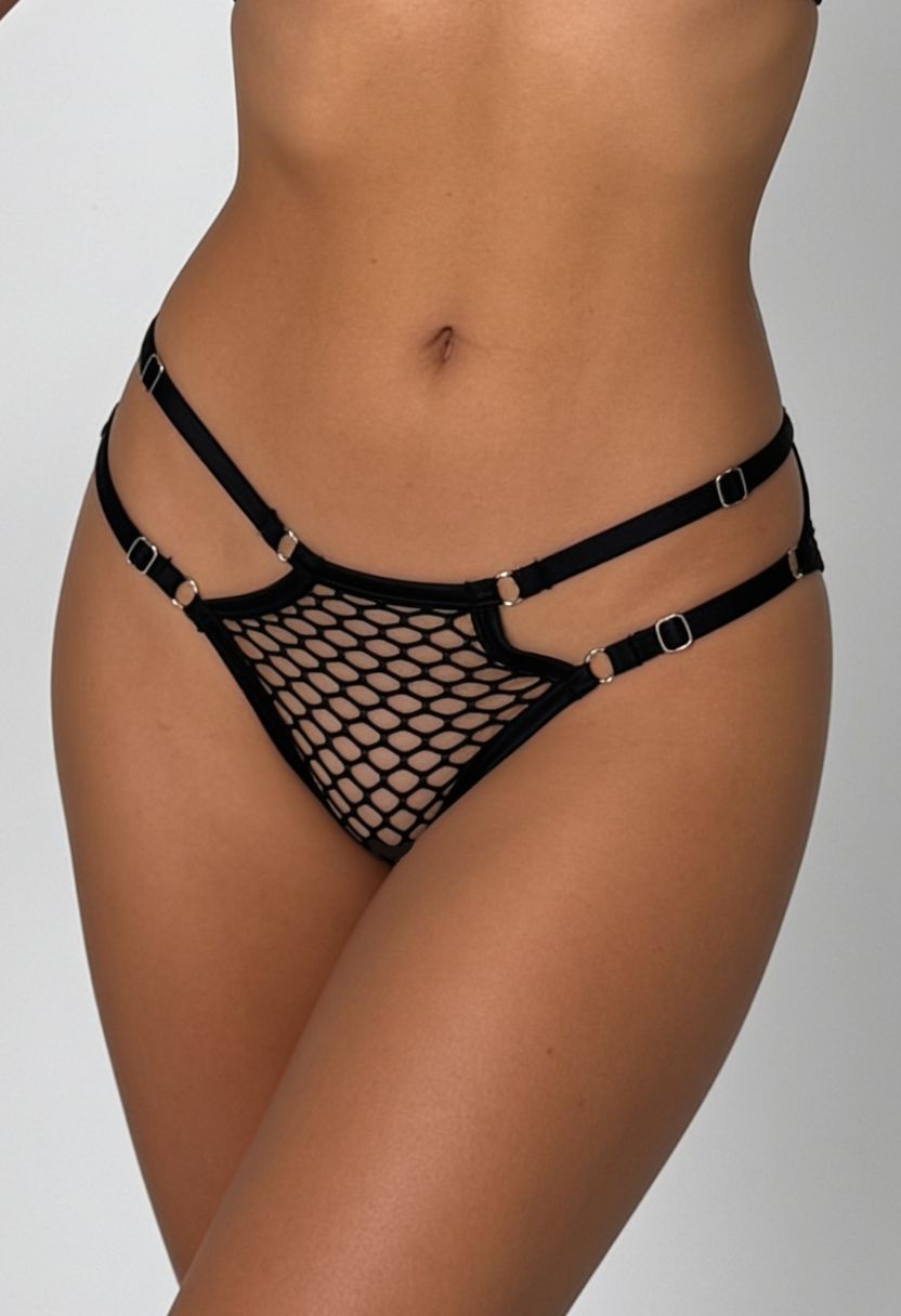 Nikita black fishnet brief with double hip strap detail, close-up front view on model
