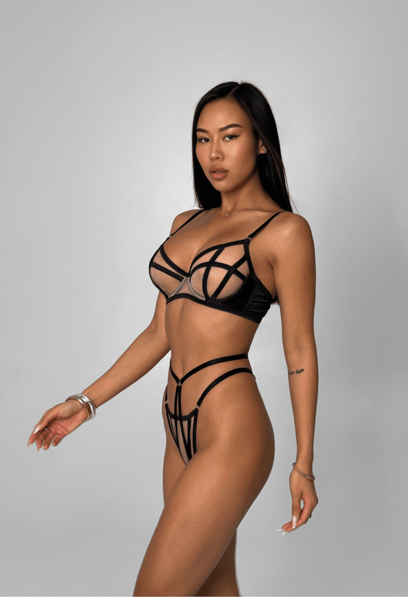 Stella nude demi bra and thong with black satin cage straps on model, front view