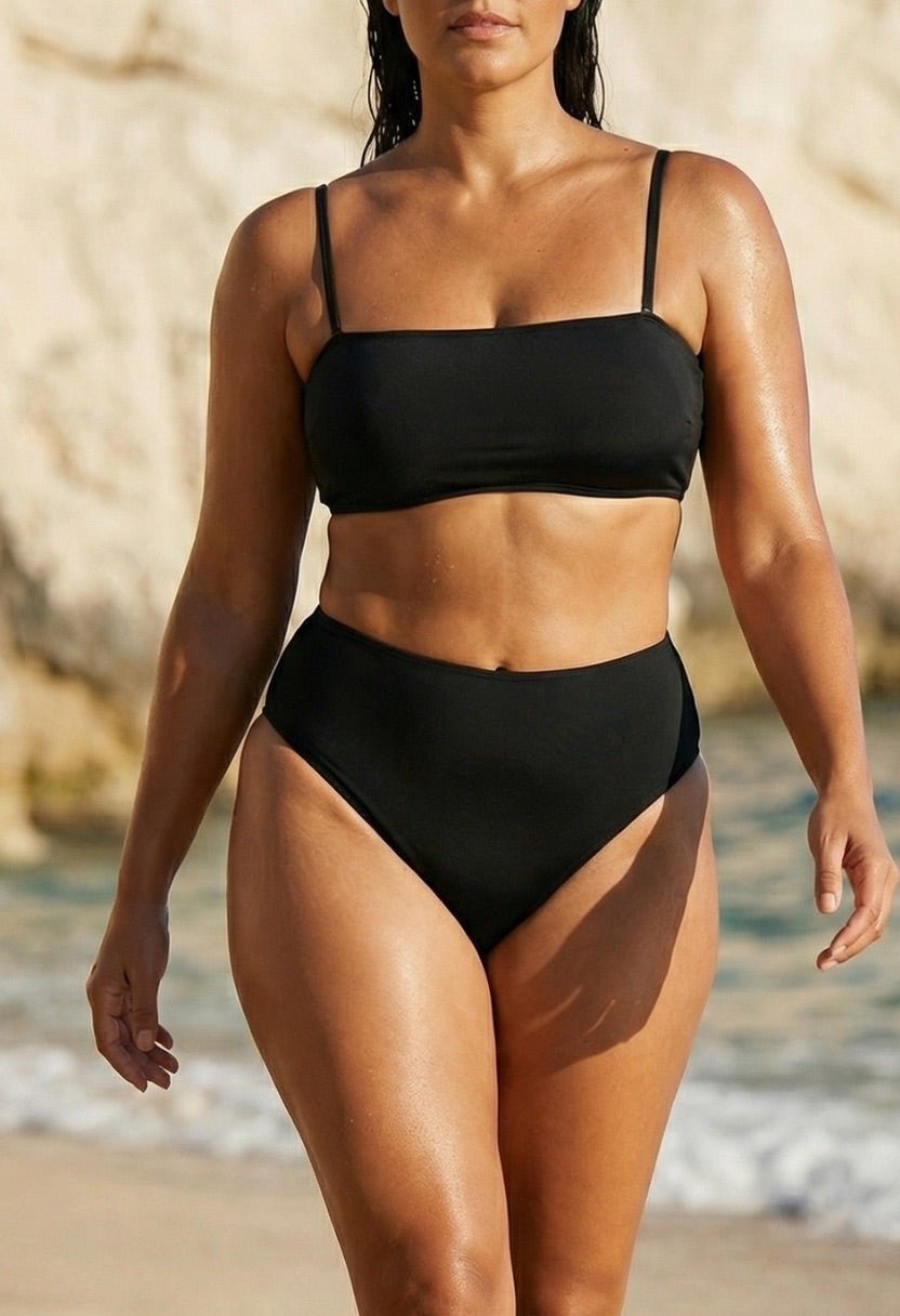 Valeria black bandeau bikini top and high-waist bottom on model, front view at beach